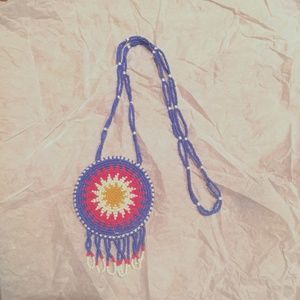 beaded necklace in radiating sun pattern blue, red, yellow